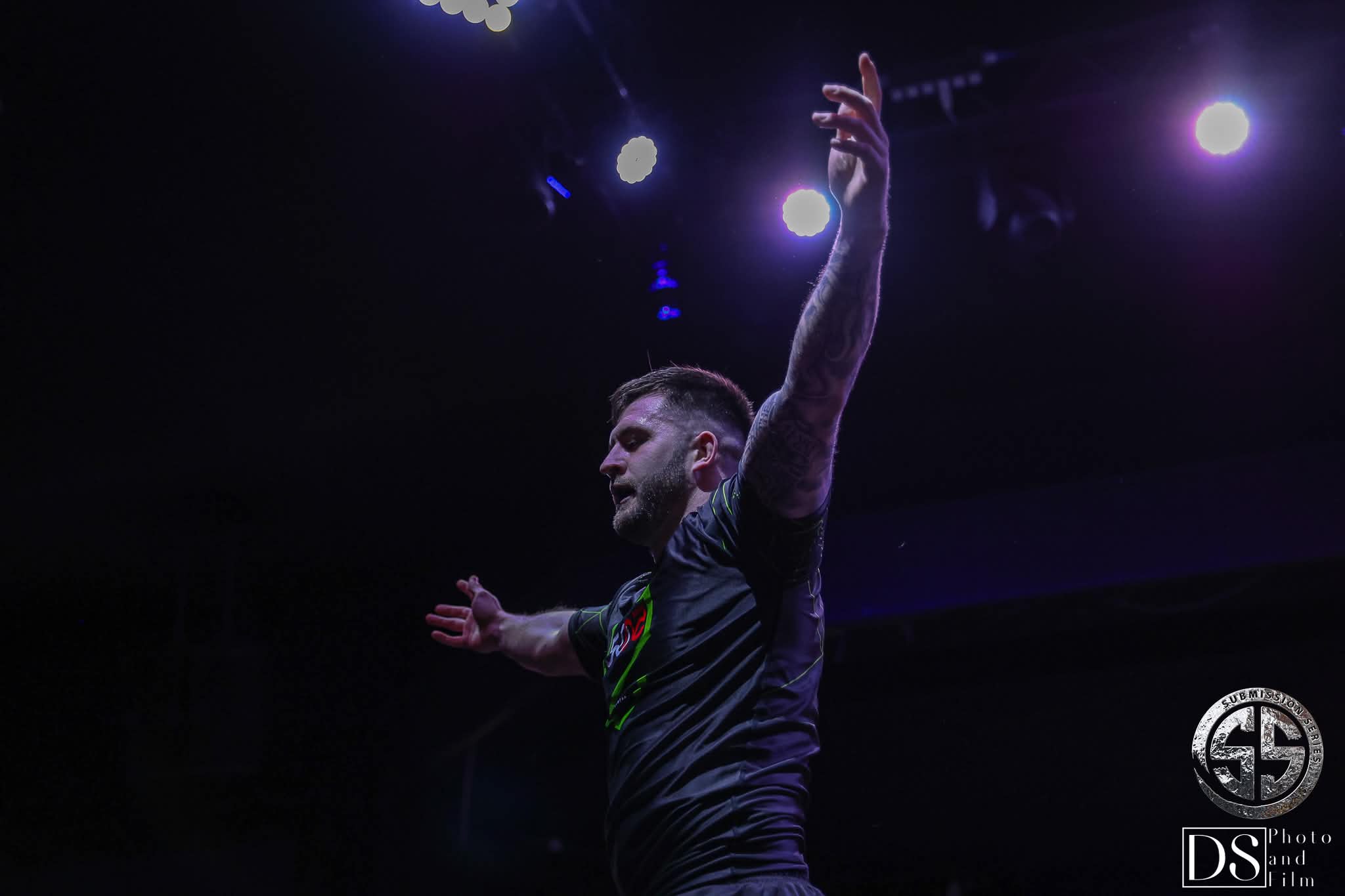 Competition moment under purple stage lighting