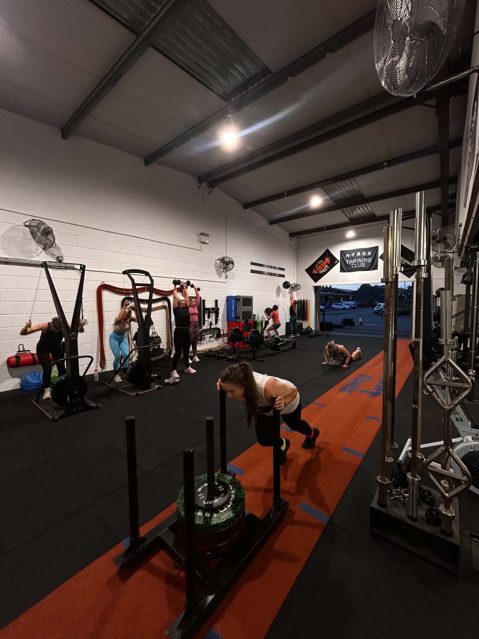 Sled push training on the gym track