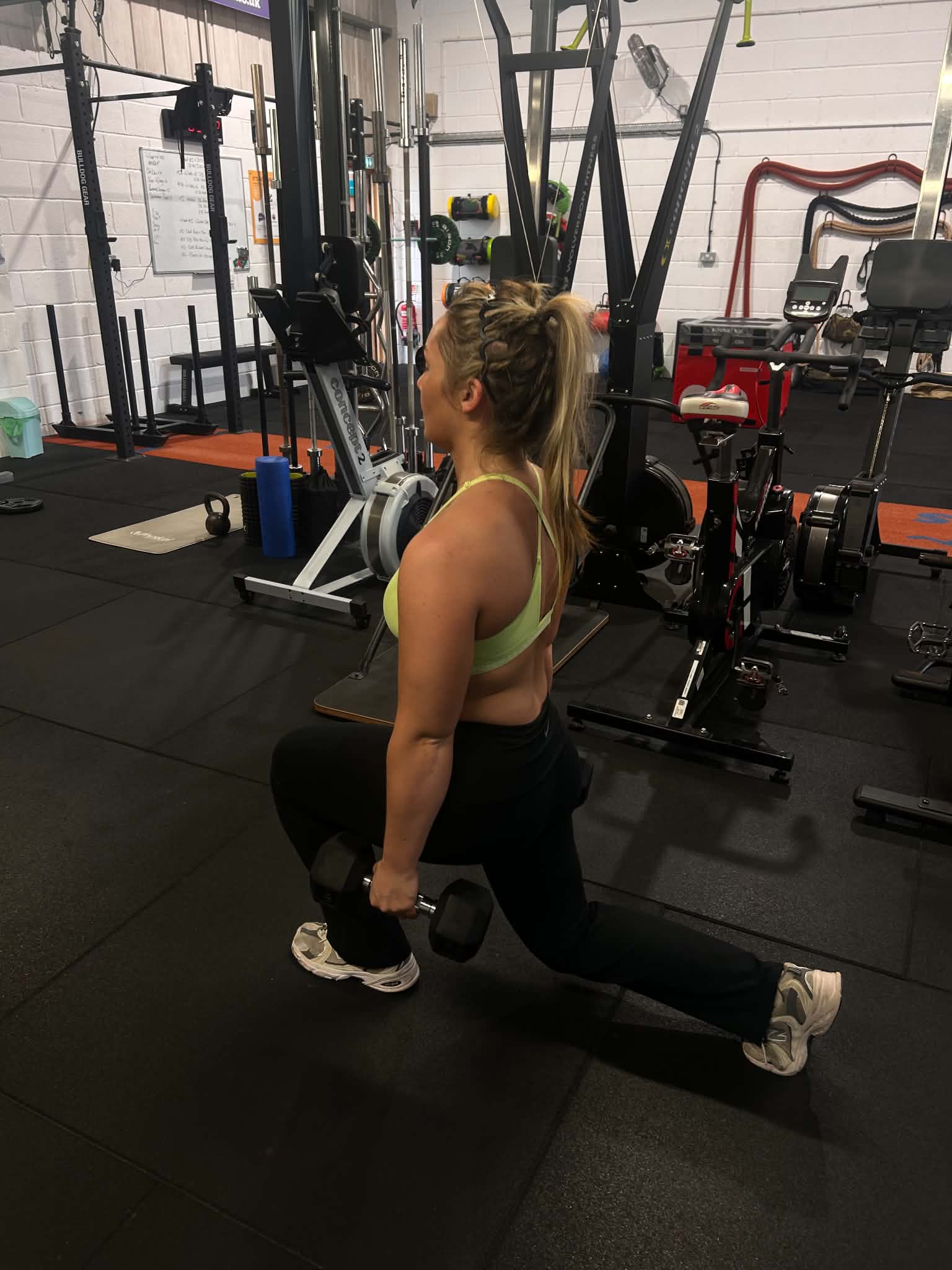 Dumbbell lunge during a strength training session