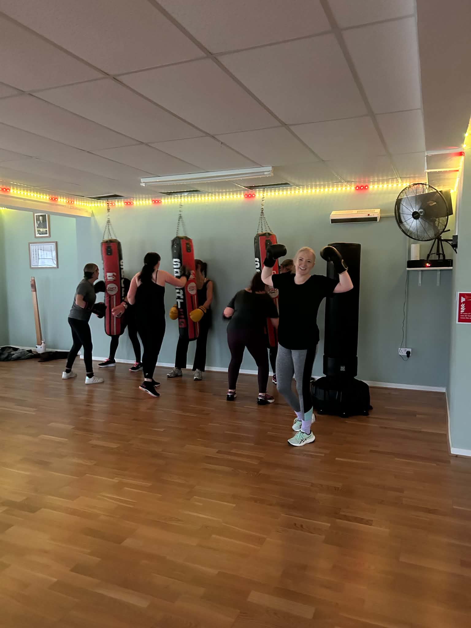 Group warm-up exercises in a fitness studio